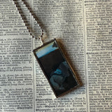 Salvador Dali Persistence of Memory upcycled to hand soldered glass pendant