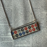 Vintage BINGO and KENO game card graphics, upcycled to soldered glass pendant