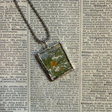 Bird on a snowy branch, vintage illustration upcycled to soldered glass pendant