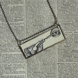 Human eye, scissors, vintage dictionary illustrations, up-cycled to soldered glass pendant