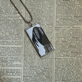 Gorey Black bird vintage book illustrations, hand-soldered glass pendant