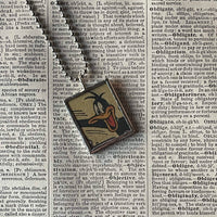 Bugs Bunny, Daffy Duck, vintage 1970s comic illustration, upcycled to soldered hand-soldered glass pendant