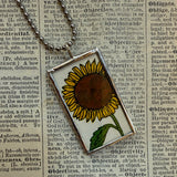 Seed packet and Sunflower botanical illustrations, up-cycled to soldered glass pendant