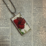 Yellow and red hibiscus, botanical illustrations, up-cycled to soldered glass pendant