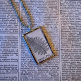 Fern fronds, vintage botanical dictionary illustration, upcycled to soldered glass pendant