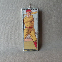 Vintage baseball player, vintage illustration from fireworks packaging, soldered glass pendant