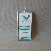 Polka band accordion player, bird with drum, vintage illustration, upcycled to soldered hand-soldered glass pendant 