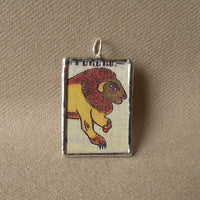 Squirrel, Lion, folk art weaving, upcycled to soldered glass pendant