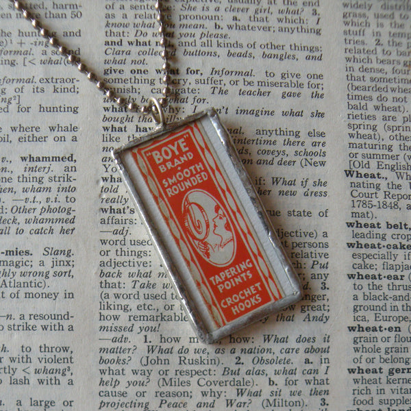 Vintage needle packaging, upcycled to hand-soldered glass pendant